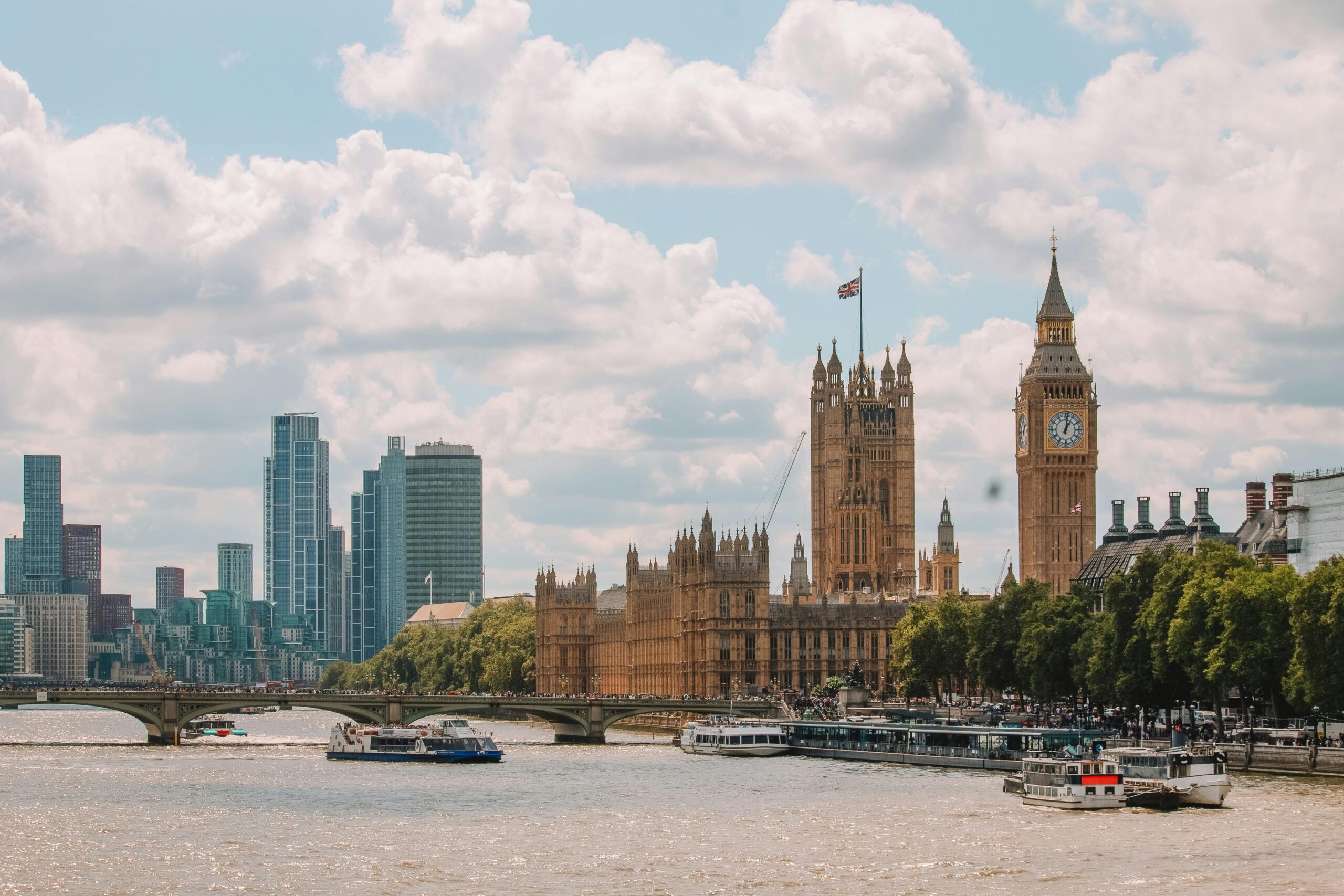 Stunning view of London's skyline featuring Big Ben and the River Thames during the day.